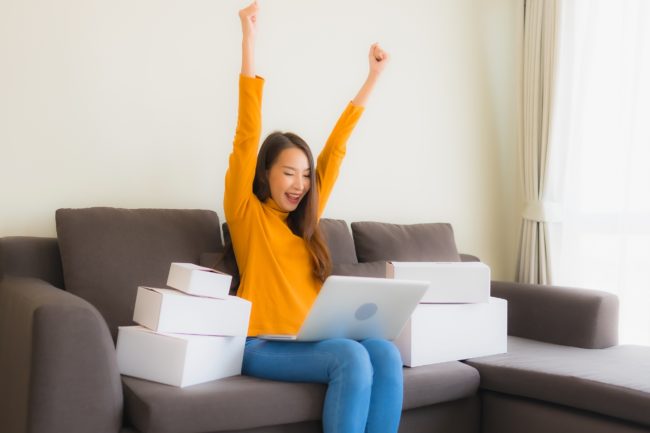 Portrait young asian woman using laptop computer for work with p